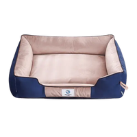 Cozy khaki dog bed (S, M, L). Features supportive raised sides for comfort & security. Plush fabric.