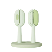 Green dog brush for shedding and moulting, slicker pet comb for grooming dogs and cats, removes loose fur and keeps coats smooth.