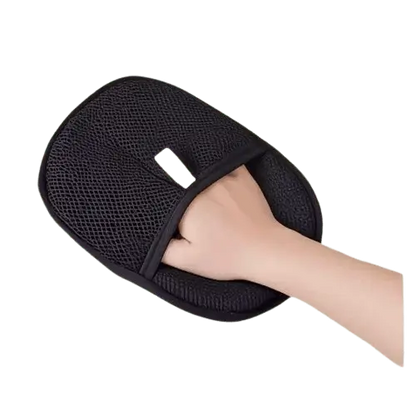 Black double-sided pet hair removal glove used to remove dog and cat hair from furniture