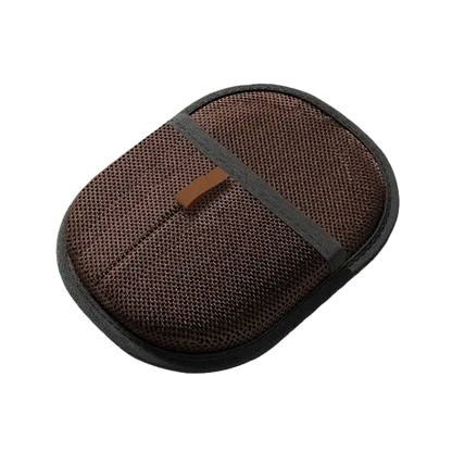 Dark brown double-sided pet hair removal glove lifting pet fur from clothes and upholstery