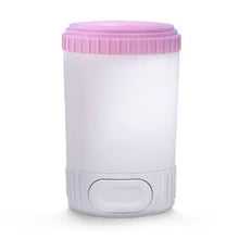Pink easy dog paw cleaner cup for dogs, gently removes mud, sand, and dirt from paws.