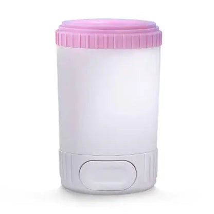 Pink easy dog paw cleaner cup for dogs, gently removes mud, sand, and dirt from paws.