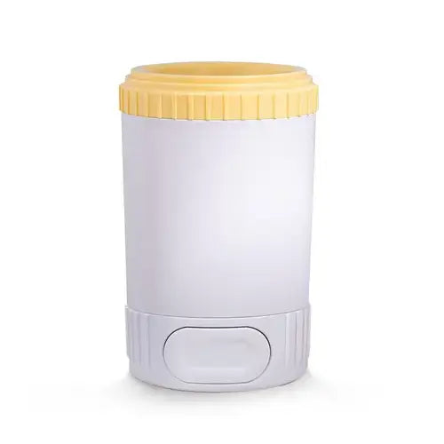 Yellow easy dog paw cleaner cup with soft silicone bristles for cleaning muddy paws.