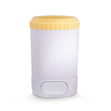Yellow easy dog paw cleaner cup with soft silicone bristles for cleaning muddy paws.