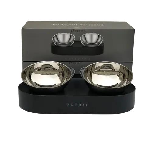 A set of elevated pet bowls for food and water, placed on a metal stand with non-slip feet.