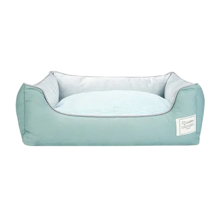 Green cotton dog bed with orthopedic support and removable cover, cozy and breathable for small and medium pets.