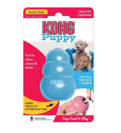 Hands filling an interactive KONG puppy chew toy made of natural rubber, ideal for teething relief, dental health, and extended play with treats