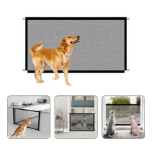 Mesh pet gate installed in doorway to keep dog safe indoors.