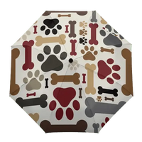 Paw print weather shield umbrella, combining art and utility. BUY FOR DOG