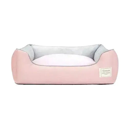 Soft pink cotton dog bed with high sides and machine-washable cover, designed for comfort and support in large dogs.